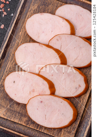 Delicious fresh boiled chicken or pork sausage cut into slices 125428184