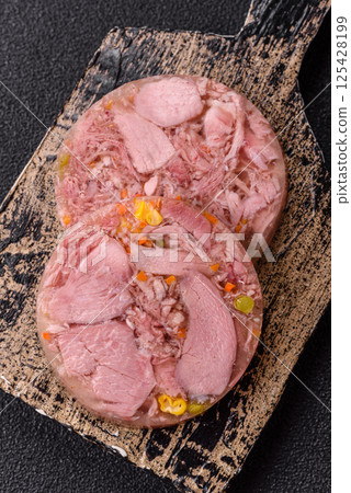 Homemade brawn with salt, spices, herbs and vegetables Homemade brawn with salt, spices, herbs and vegetables 125428199