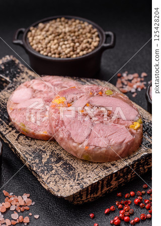 Homemade brawn with salt, spices, herbs and vegetables 125428204