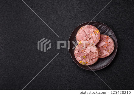 Homemade brawn with salt, spices, herbs and vegetables Homemade brawn with salt, spices, herbs and vegetables 125428210