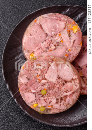 Homemade brawn with salt, spices, herbs and vegetables Homemade brawn with salt, spices, herbs and vegetables 125428215