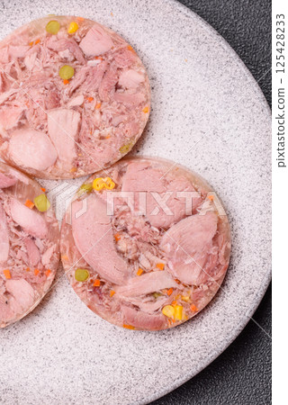 Homemade brawn with salt, spices, herbs and vegetables Homemade brawn with salt, spices, herbs and vegetables 125428233