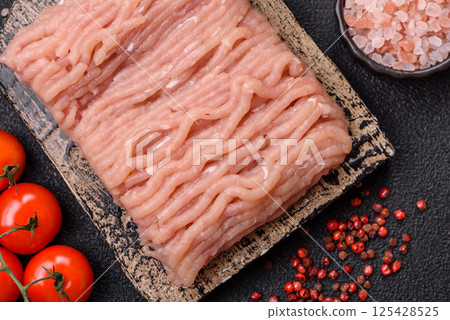 Raw minced chicken with salt, spices and herbs 125428525