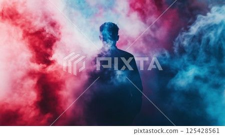 Mysterious silhouette surrounded by red and blue smoke in dramatic lighting Mysterious silhouette surrounded by red and blue smoke in dramatic lighting 125428561