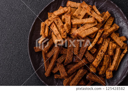 Crispy homemade brown bread crackers or croutons with seeds and grains Crispy homemade brown bread crackers or croutons with seeds and grains 125428582
