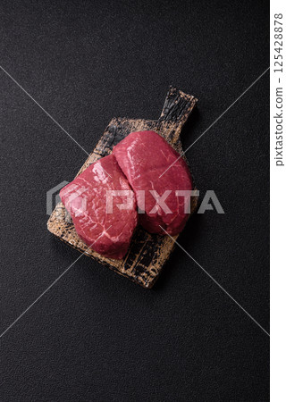 Raw beef tenderloin ribeye steak with salt and spices Raw beef tenderloin ribeye steak with salt and spices 125428878