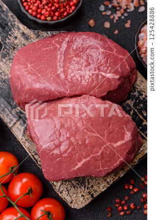 Raw beef tenderloin ribeye steak with salt and spices 125428886