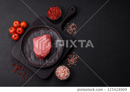 Raw beef tenderloin ribeye steak with salt and spices 125428909