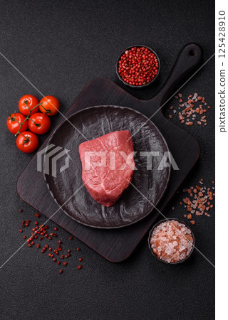 Raw beef tenderloin ribeye steak with salt and spices Raw beef tenderloin ribeye steak with salt and spices 125428910