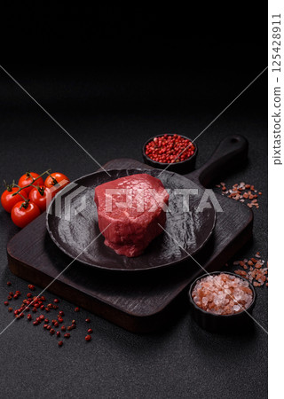 Raw beef tenderloin ribeye steak with salt and spices Raw beef tenderloin ribeye steak with salt and spices 125428911