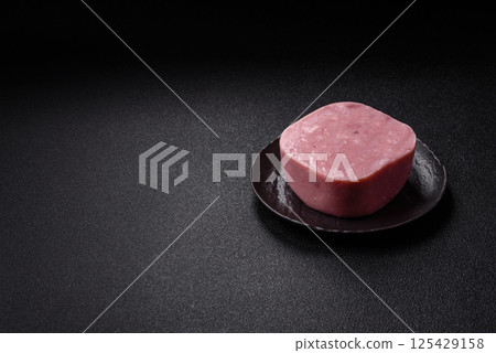 Delicious canned pink ham with salt, spices and herbs Delicious canned pink ham with salt, spices and herbs 125429158