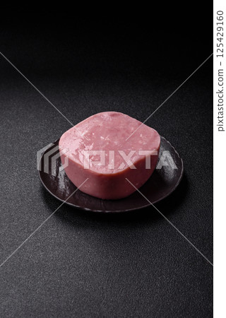 Delicious canned pink ham with salt, spices and herbs Delicious canned pink ham with salt, spices and herbs 125429160