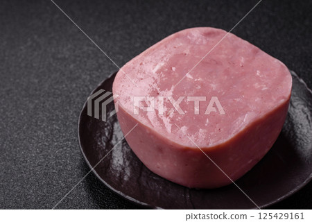 Delicious canned pink ham with salt, spices and herbs Delicious canned pink ham with salt, spices and herbs 125429161