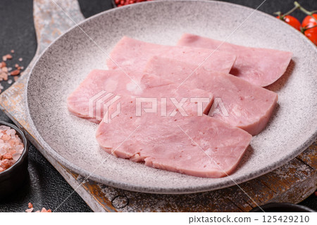 Delicious canned pink ham with salt, spices and herbs 125429210