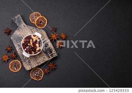 Mixture of roasted cashews and dried cranberries Mixture of roasted cashews and dried cranberries 125429333
