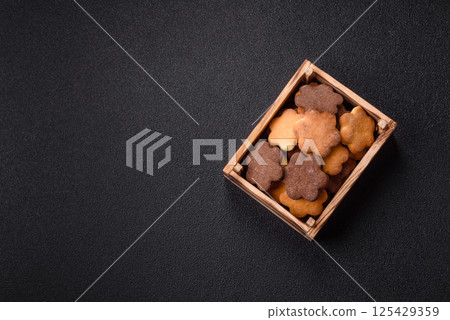 Ginger sweet cookies in yellow and brown color 125429359