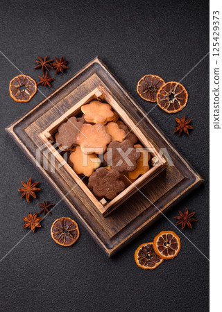 Ginger sweet cookies in yellow and brown color 125429373