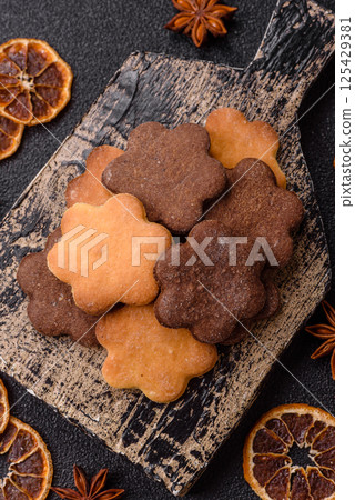 Ginger sweet cookies in yellow and brown color 125429381