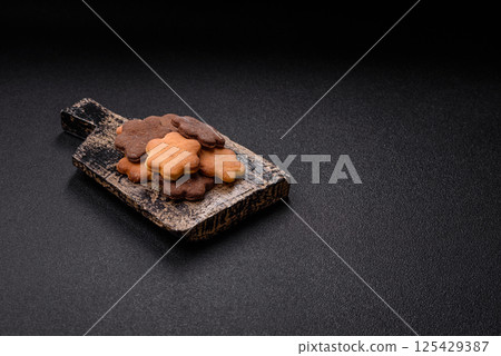 Ginger sweet cookies in yellow and brown color 125429387