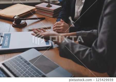Judge gavel with Justice lawyers having team meeting at law firm background. Concepts of Law and Legal services. Judge gavel with Justice lawyers having team meeting at law firm background. Concepts of Law and Legal services. 125429939