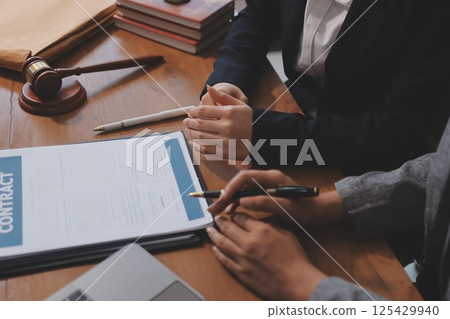 Judge gavel with Justice lawyers having team meeting at law firm background. Concepts of Law and Legal services. Judge gavel with Justice lawyers having team meeting at law firm background. Concepts of Law and Legal services. 125429940