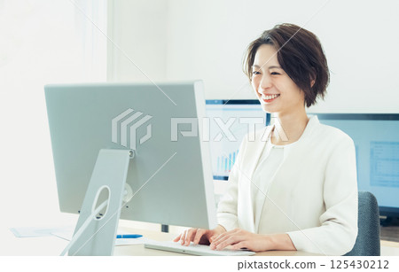 Businesswoman working with digital transformation tools Businesswoman working with digital transformation tools 125430212