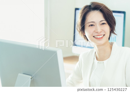 Businesswoman working with digital transformation tools 125430227