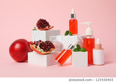 Self care and skincare products concept - pomegranate cosmetics Self care and skincare products concept - pomegranate cosmetics 125430403