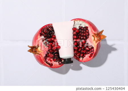 Self care and skincare products concept - pomegranate cosmetics Self care and skincare products concept - pomegranate cosmetics 125430404