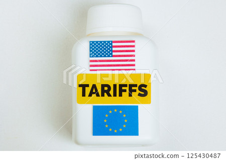 Trade medicine bottle with TARIFFS label and flags Trade medicine bottle with TARIFFS label and flags 125430487