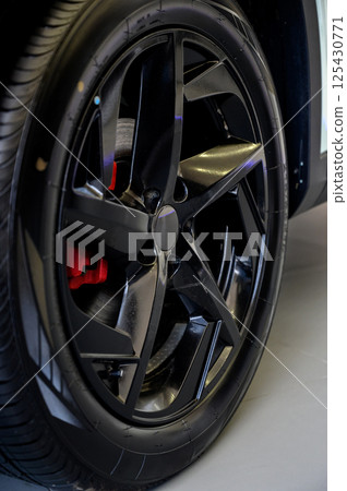 Car wheel with brake calipers and stylish design. Car wheel with brake calipers and stylish design. 125430771