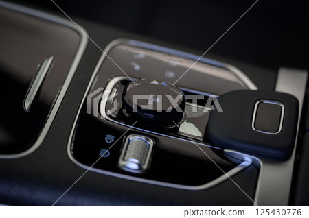 Automatic transmission selector in the interior of a modern car. 125430776