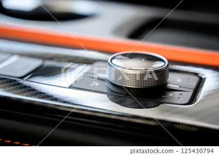 Automatic transmission selector in the interior of a modern car. 125430794