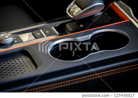 Cup holders inside modern car interior Cup holders inside modern car interior 125430817
