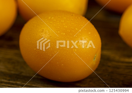 wet tomatoes with dense and juicy flesh, close up 125430994