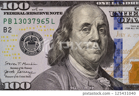part of a paper bill of American dollars with a pattern close up, top view 125431040
