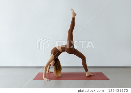 Slim body and health care. Urdhva Dhanurasana , Inverted Bow Pose or Bridge Pose 125431370