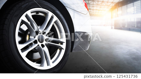 Close-up of a car alloy wheel rim and tire Close-up of a car alloy wheel rim and tire 125431736