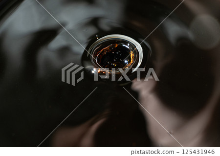 Shiny Drop of Dark Soy Sauce Macro Shot 125431946