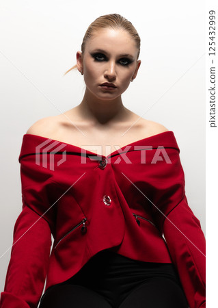Beautiful and seductive looking woman close-up studio portrait 125432999