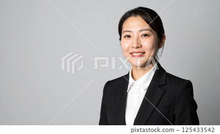 Calm smiling business woman Calm smiling business woman 125433542