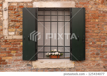 Brick Wall Window with Flower Box 125434077