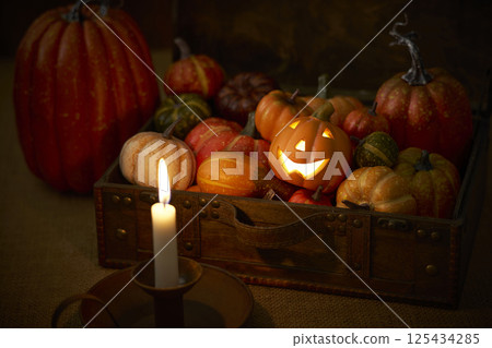 Pumpkins stuffed into an old trunk - Halloween image Pumpkins stuffed into an old trunk - Halloween image 125434285
