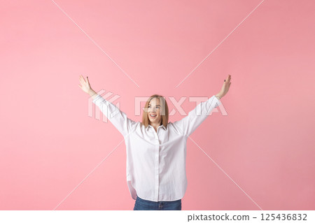 Happy Woman Celebrating on Pink Background 125436832