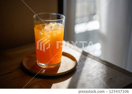 Freshly squeezed homemade mandarin juice Freshly squeezed homemade mandarin juice 125437106