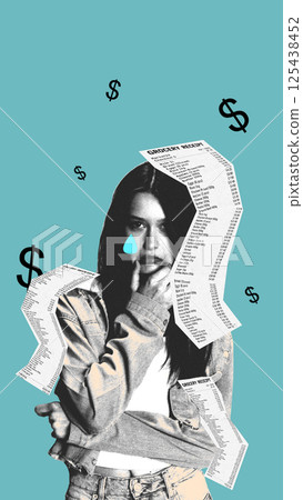 Sad girl with blue teardrop stands among flying receipts reflecting emotional weight of economic struggle. 125438452