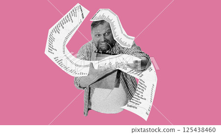 Confused man holding groceries covered by flying receipts showing overwhelming impact of shopping costs. 125438460