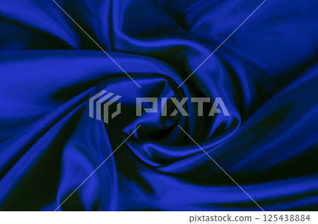Top view of dark blue silk cloth with silky sheen suitable for design and wallpaper background. 125438884