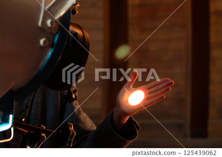 Man's hand illuminated by focused telescope light beam. Man's hand illuminated by focused telescope light beam. 125439062