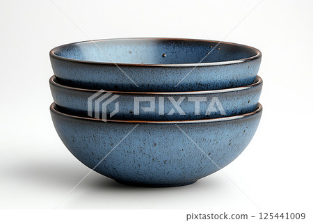 Set of blue bowls on a white background. 125441009